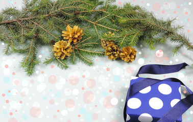 New year gift, branches of a christmas tree cones decorative colored bokeh      