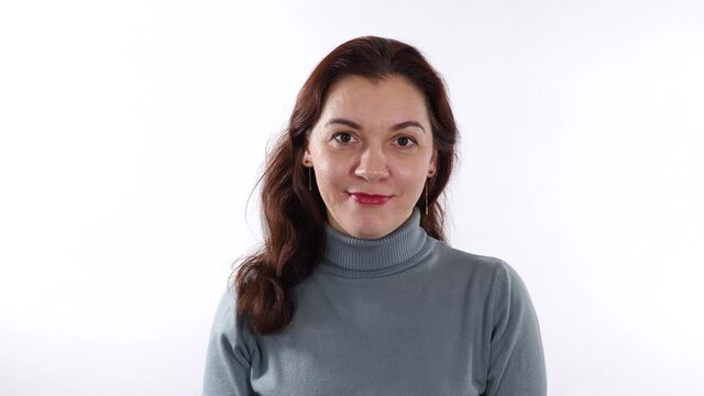 Brunette caucasian woman showing sign - Victory sign. Finger gesture concept. Signal using palm pointing outward, two fingers up.