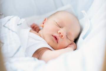 Sleeping newborn in the crib