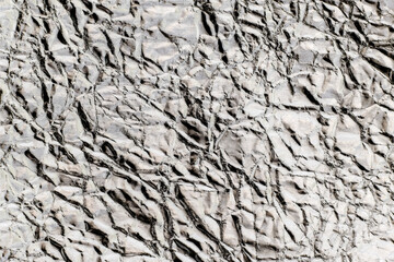 Crumpled wrinkled silver foil texture
