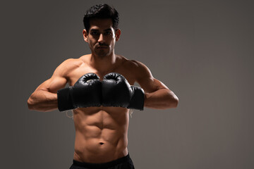 Confident Latin Athlete Wearing Boxing Gloves