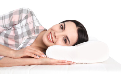 Obraz premium Young woman lying on orthopedic pillow against white background, closeup