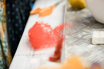 Close-up of red rusty crimson carmine maroon firebrick coloured worsted merino wool with focus on...