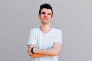 Obraz premium Good looking man, portrait on grey background