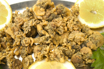 fried orziadas typical fish dish from Sardinia in Italy
