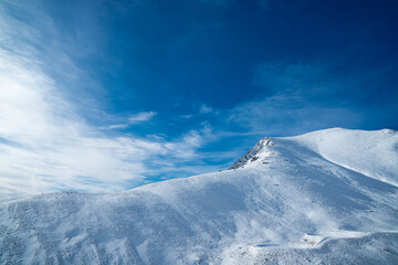 Winter landscape of snow mountain against blue sky in South island, New Zealand.