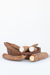 Fresh Cassava root isolated on a white background. Space copy.
