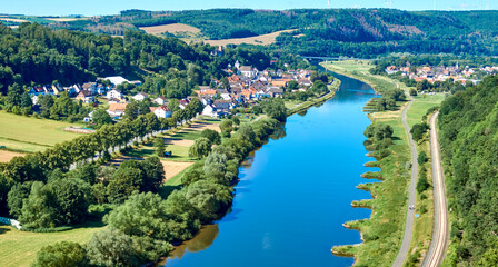 Aerial view of the Weser near Beverungen, Germany, with fields and meadows in the foreground