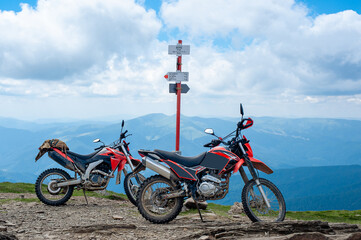 Fototapeta na wymiar two motorcycles on the top of Mount Petros
