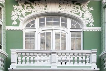 balcony on the old facade with stucco