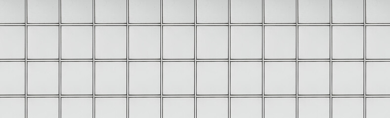 Panoramic texture of white metal block wall seamless background