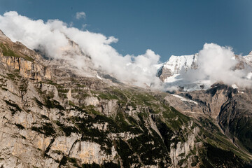 , Scenic view on green mountings and sky in Lauterbrunnen Valley, Switzerland, Scenic view on green...