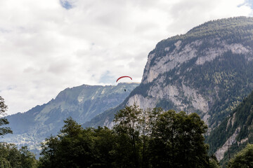 Scenic view on green mountings and sky in Lauterbrunnen Valley, Switzerland