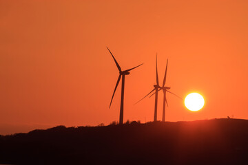 Obraz premium Wind Turbines Haven Waterway Pembroke Dock Pembrokeshire Wales at sunset