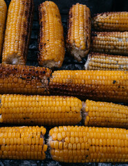 Corn fried on the fire. Hot sweet corn grill. An ear of corn. Healthy food for vegans.