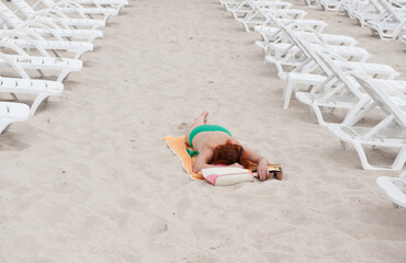 women,sleep,beach,rest alone,sand,summer,bikini,vacation,person,travel,sun loungers on the beach,sunbathing on the beach,sky