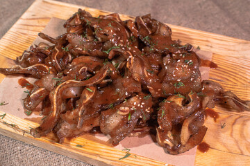Freshly cooked pork ears in Tabasco sauce