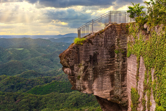 Sunset on the cliff of Jigoku Nozoki meaning Peep into Hell jutting out over the void on a stunning panoramic vantage point in the Mount Nokogiri quarry.