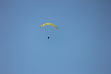 paragliding in the blue sky