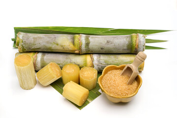sugar cane and brown sugar on white isolate background