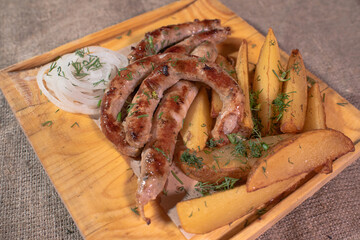 Delicious Provencal sausages with rustic potatoes and onions