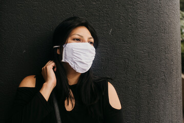 A female wearing a face mask