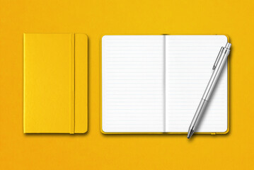 Yellow closed and open notebooks with a pen isolated on colorful background