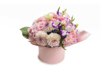 Pink and purple bouquet of flowers in a pink box isolated on white.