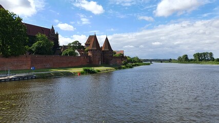 Fototapeta na wymiar Castle in Malbork on the Nogat River, Poland
