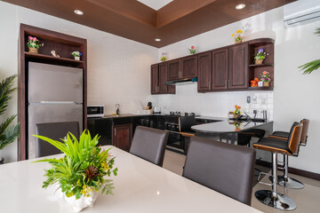 Interior and exterior design of open space living room and dining area feature wooden dining table