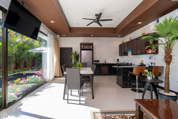 Interior and exterior design of open space living room and dining area feature wooden dining table