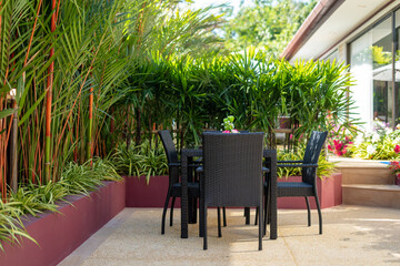Exterior design of house, home and villa feature outdoor dining table and dining chair in the...