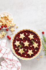 Homemade cherry pie, tart with star shaped cookies