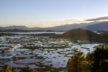 Fototapeta premium sunset in the mountains and aerial view of loktak lake