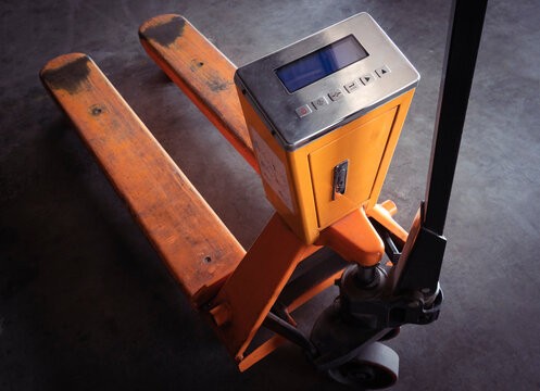 Hand Pallet Truck Or Manual Hand Lift With Check Weigh Digital Scales.