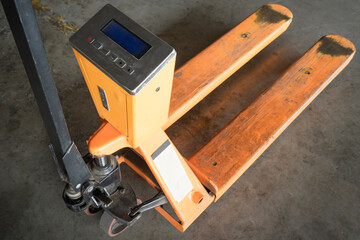Hand pallet truck or manual hand lift with check weigh digital scales.