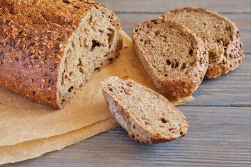 Rye and wheat bread with sunflower seeds on a wooden table