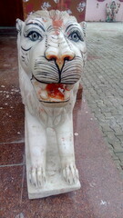 lion statue in front of a temple