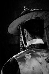 Vertical grayscale shot of a Korean warrior