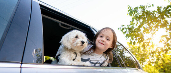 Little girl with her puppy
