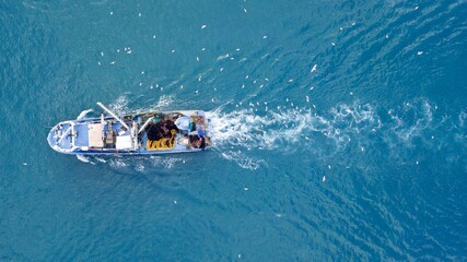 Naklejka premium aerial view of the fishing boat at the sea