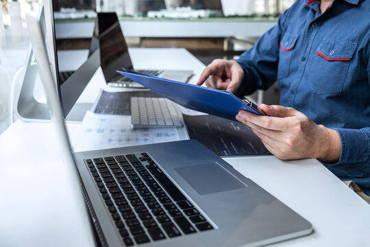 Developer programmer working on project in software development computer in IT company office, Writing codes and data code website and coding database technologies to find solution to problem