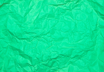 Crumpled green background. Wrinkled green texture.