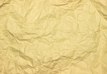 Crumpled yellow background. Wrinkled yellow texture.