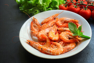 shrimp cooked seafood ready to eat prawn serving size. food background top view copy space healthy eating raw pescetarian 