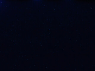 Liguria, Italy - 07/22/2020: Beautiful photography of the moonlight in the different phases with different colours. Black sky and little stars in the background.