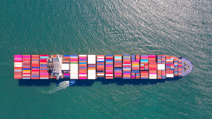 Container , container ship in export and import business and logistics. Shipping cargo to harbor by...