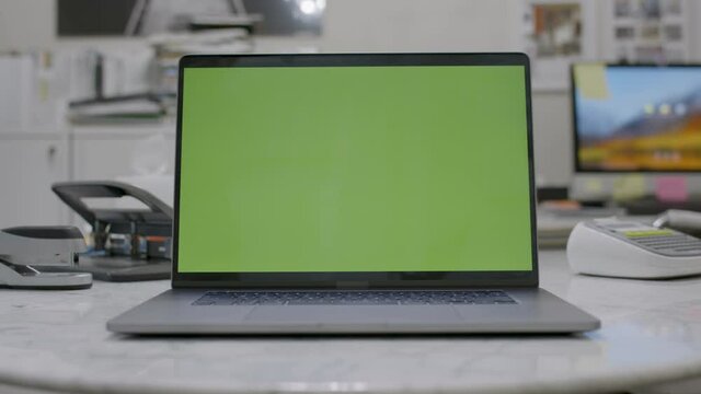 Remote working. Home office setup. Green screen laptop computer sitting on Footage shot with RED, available in 4K and HD. Download the preview for free.
