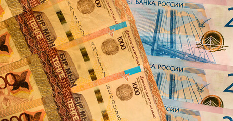 Russian rubles and Kazakhstani tenge. Money background. Financial crisis, ruble devaluation concept. Russian and Kazakh currencies. Currency exchange.