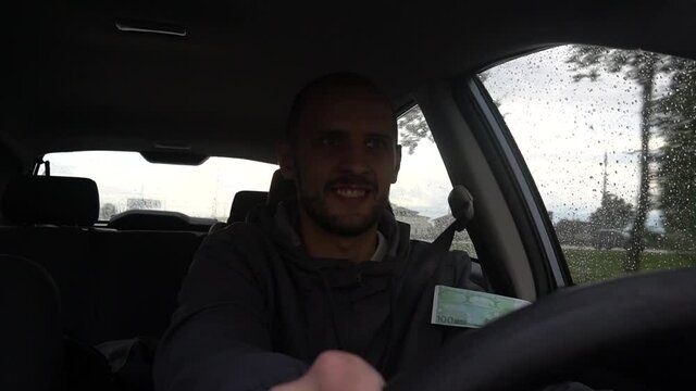 Happy driver with big money euro. Success. Concept on the business success, topic of lottery, winnings, slot machines.